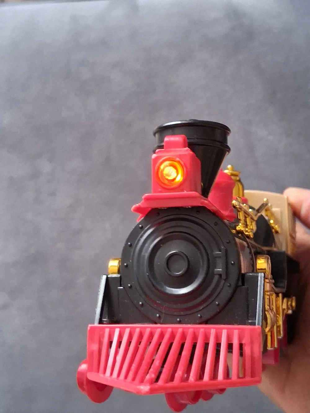 Vintage Style Black and Gold Toy Train with Red Accents